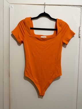 Babaton Orange Short Sleeve Scoop Neck Bodysuit